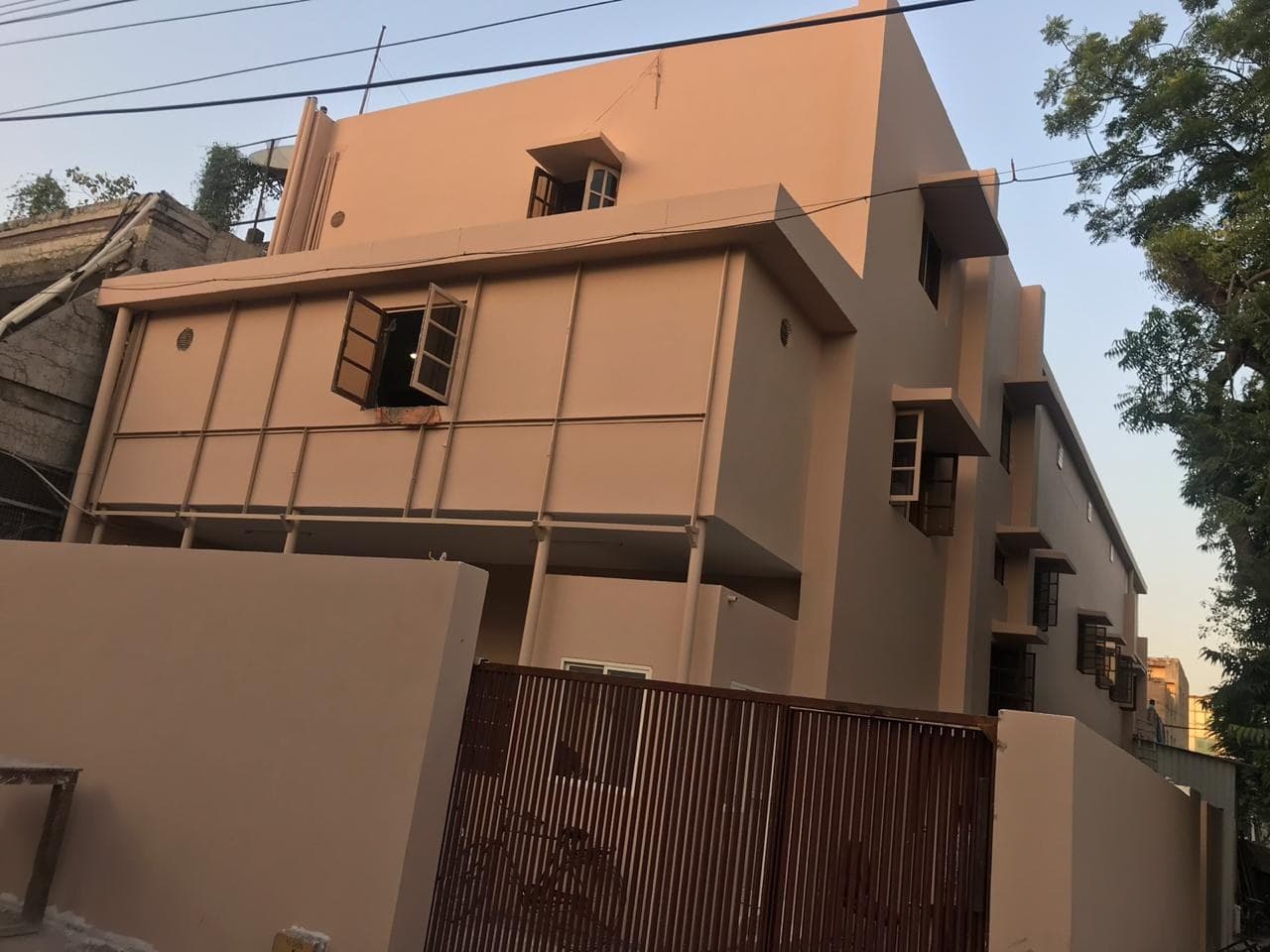 The JDKD property at E-43/7, Okhla Industrial Area, Phase-2, behind its boundary wall and gate.